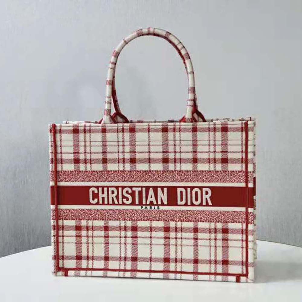 Close-up of raspberry embroidery and silver hardware on the Small Dior Book Tote