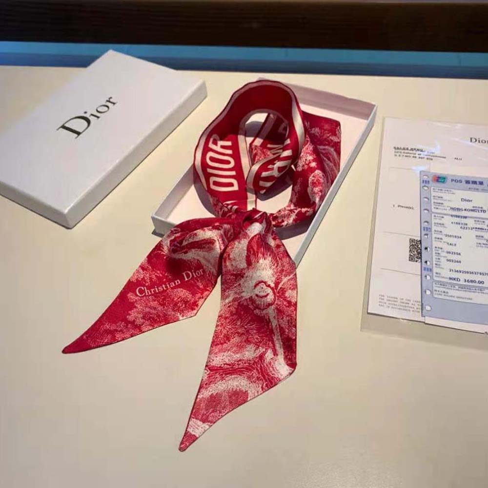Close-up showing intricate Toile de Jouy print on Dior silk twill scarf
