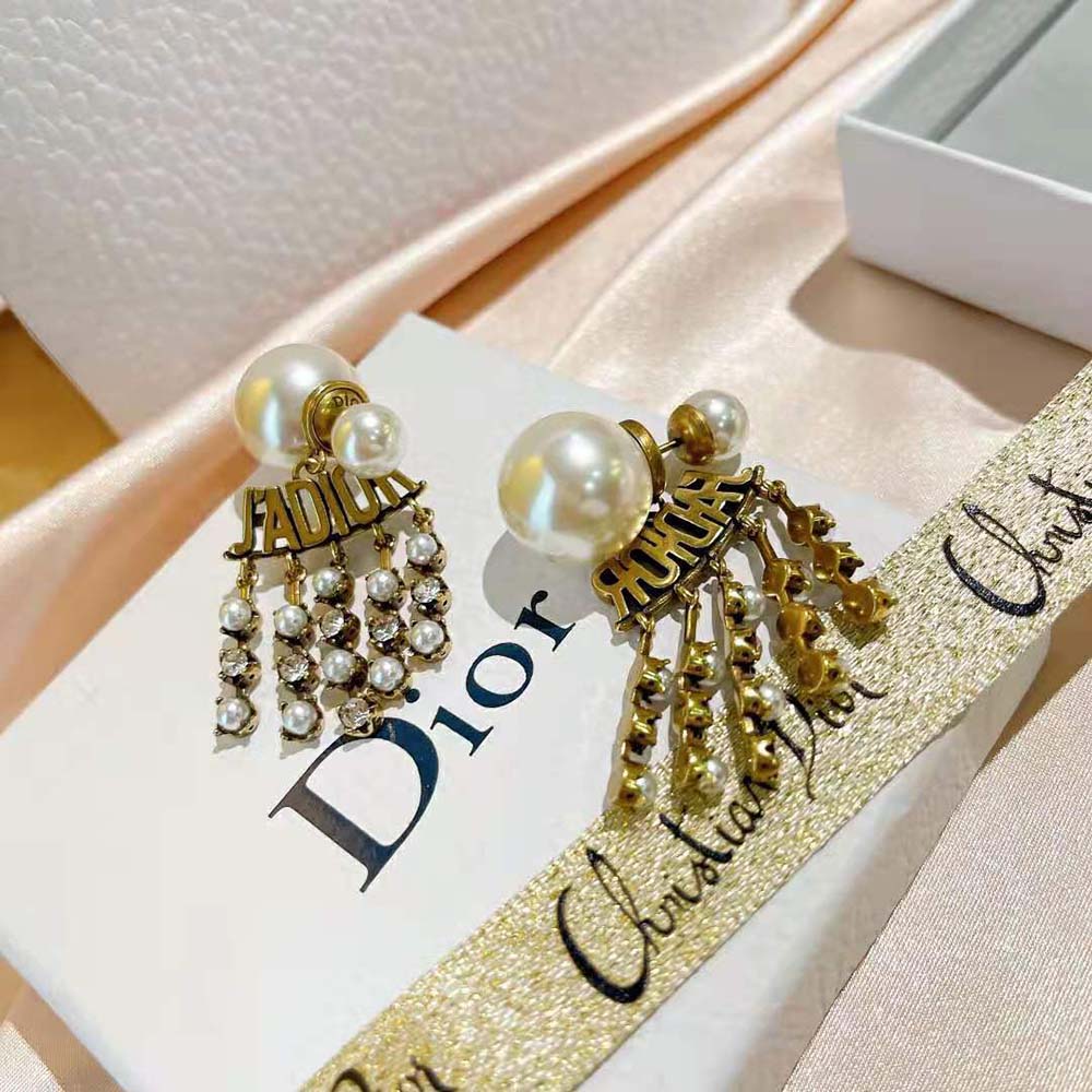 Styled shot of Dior Women Tribales Earrings highlighting pearl detail