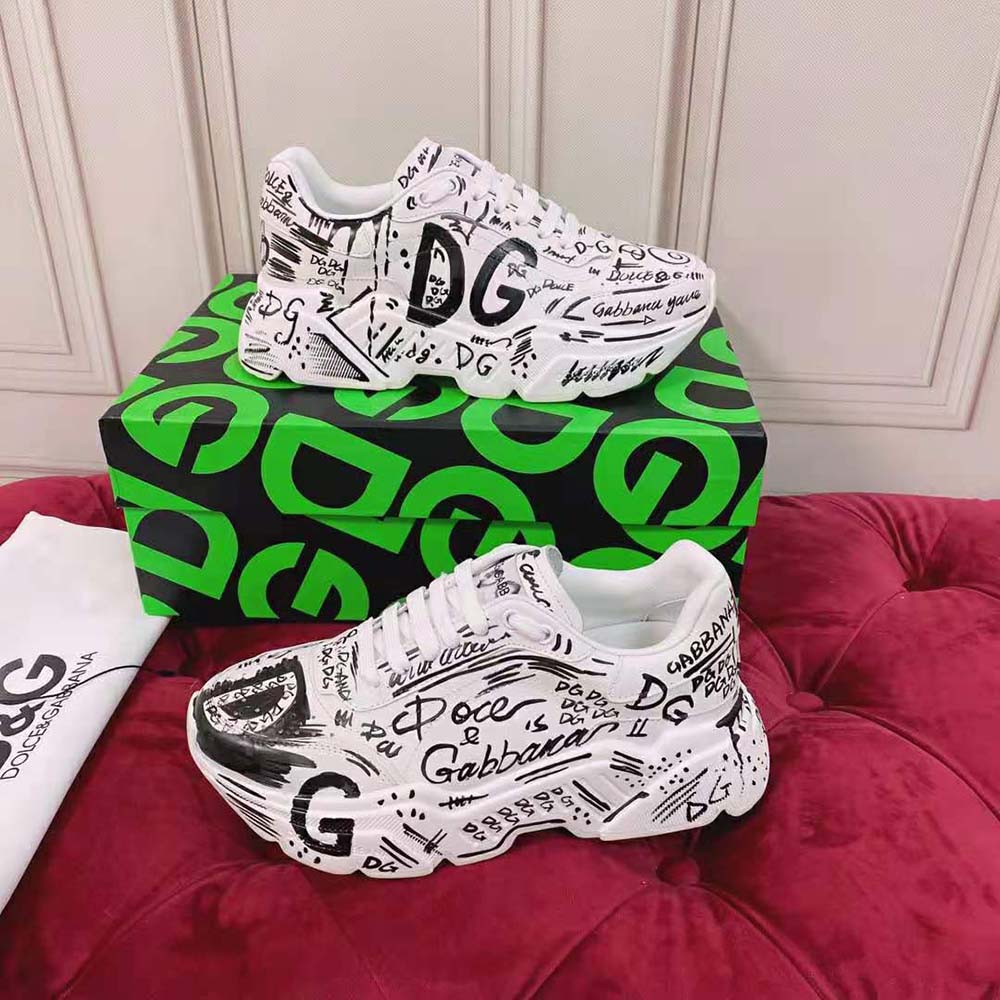 Close-up of hand-painted graffiti detail on white calfskin nappa Daymaster sneakers