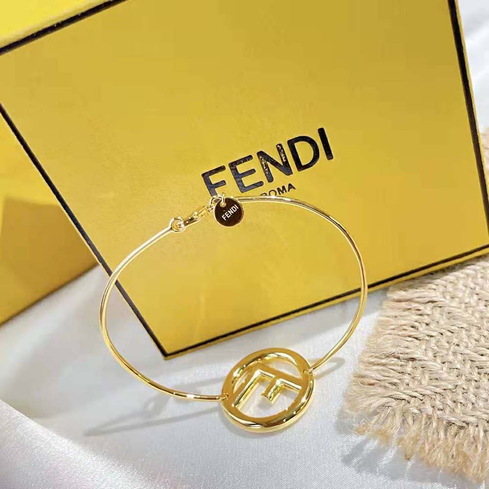 Fendi Women F is Fendi Bracelet Gold Color Bracelet styled on wrist outdoors