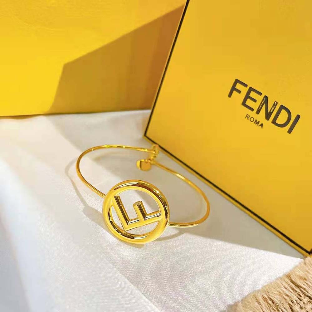 Side angle of Fendi Women F is Fendi Bracelet Gold Color Bracelet with clasp visible