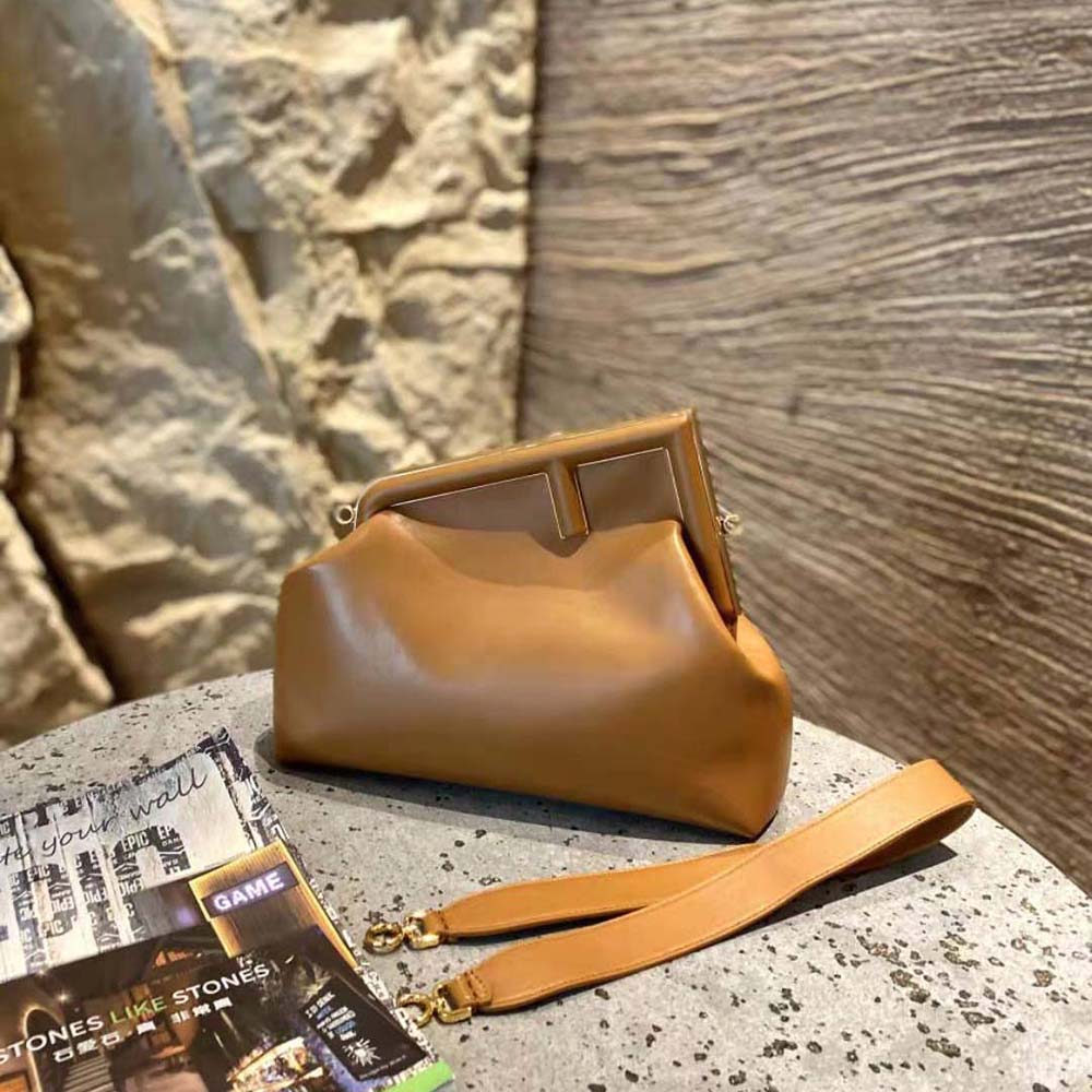 Close-up of gold hardware on Fendi Women First Medium Nappa Leather Bag-Brown