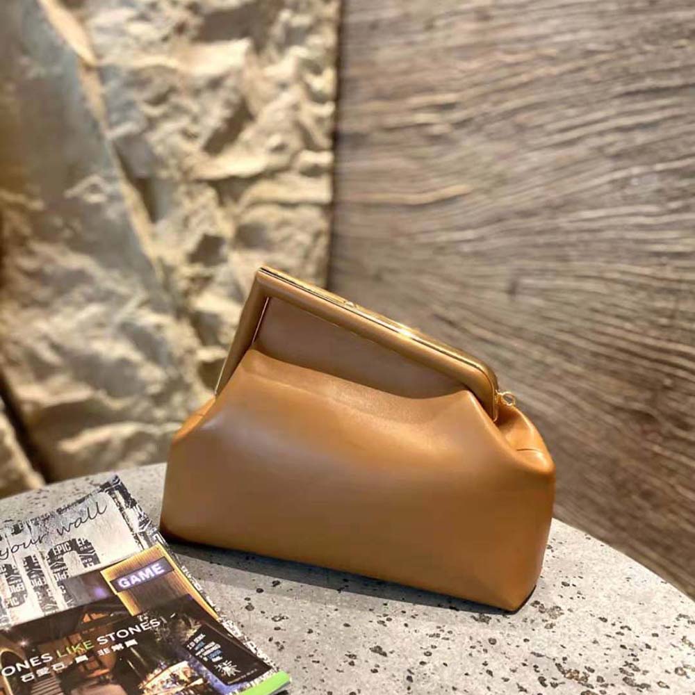 Side angle showcasing silhouette of Fendi Women First Medium Nappa Leather Bag-Brown
