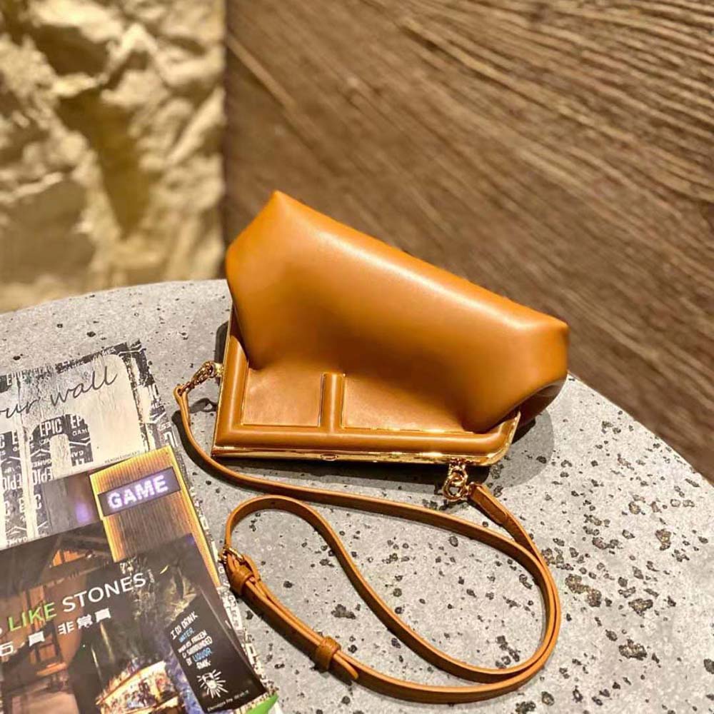 Side profile showing compact silhouette of Fendi Women First Small Nappa Leather Bag-Brown