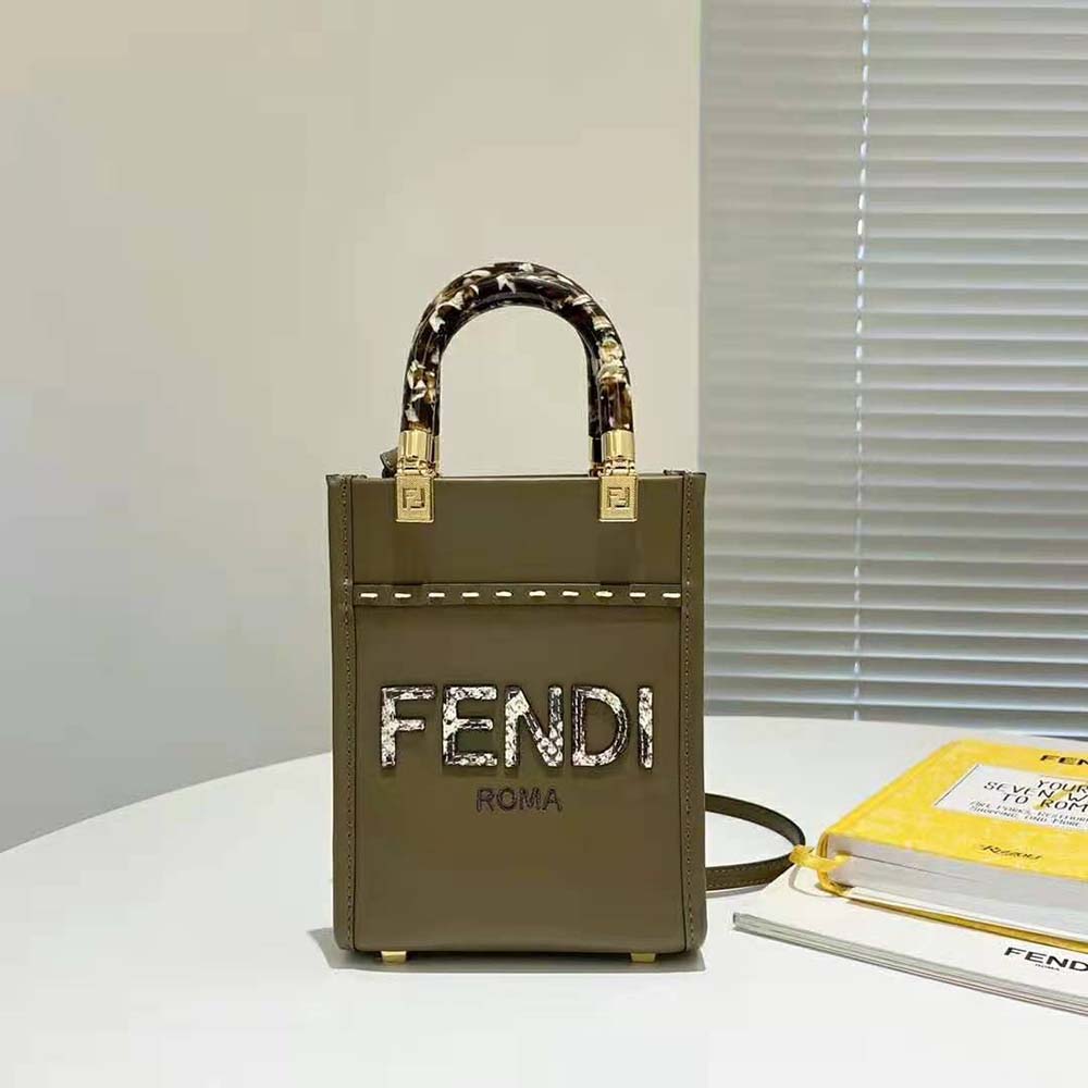 Close-up of gold-tone hardware on Fendi Women Mini Sunshine Shopper bag