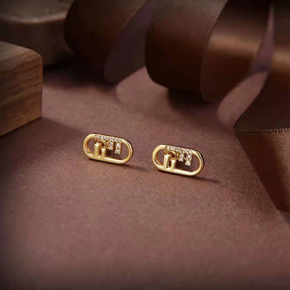Close-up detail of Fendi Women O’lock Earrings highlighting gold finish and logo hardware