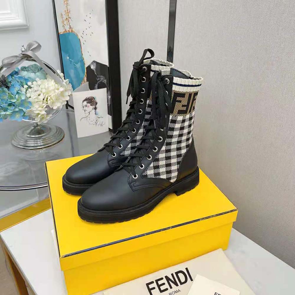 Close-up on branded hardware and leather detail of Fendi Rockoko boots
