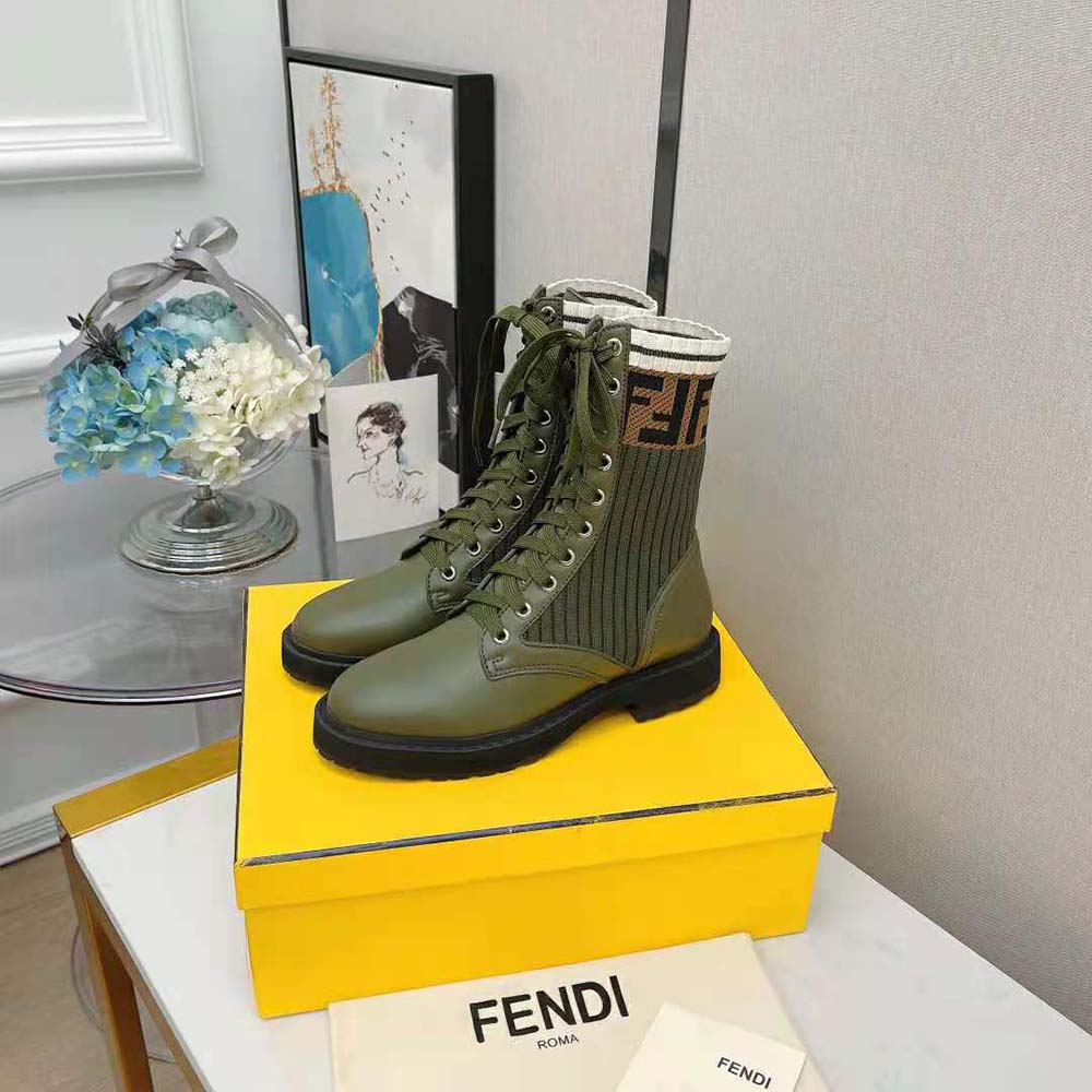 Close-up detail of green leather and Fendi logo hardware on Rockoko boots
