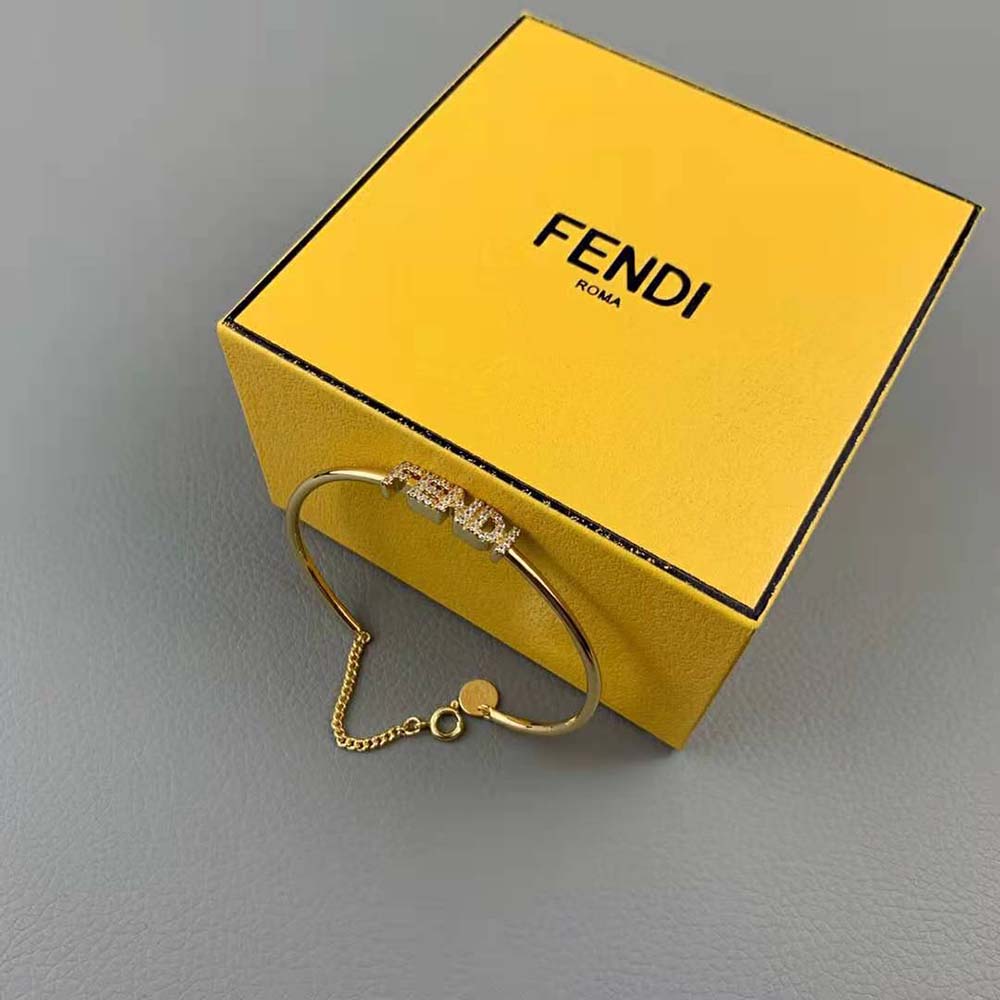 Side angle of Fendi Women Signature Bracelet Gold-Colored Bracelet showing signature hardware