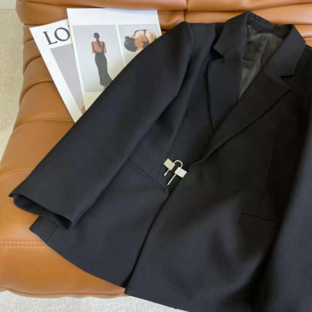 Side profile showing tailored silhouette of Givenchy Women Jacket black wool