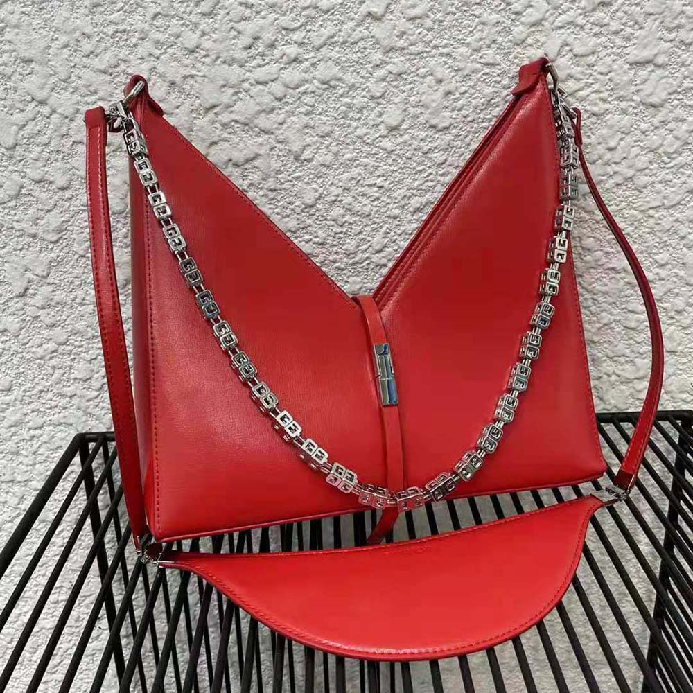 Close-up of red box leather and silver chain on Givenchy Small Cut Out Bag