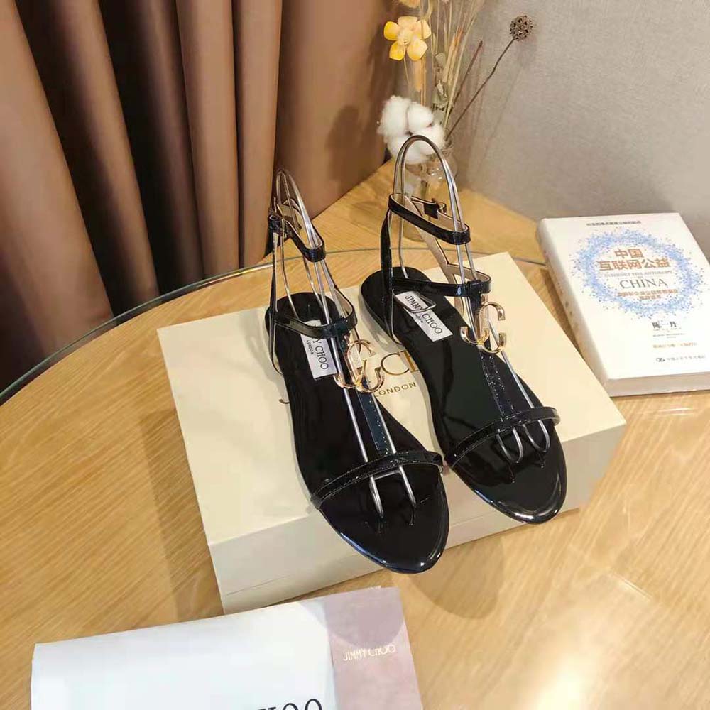 Close-up of patent leather detail on Jimmy Choo Women Alodie Flat Sandals