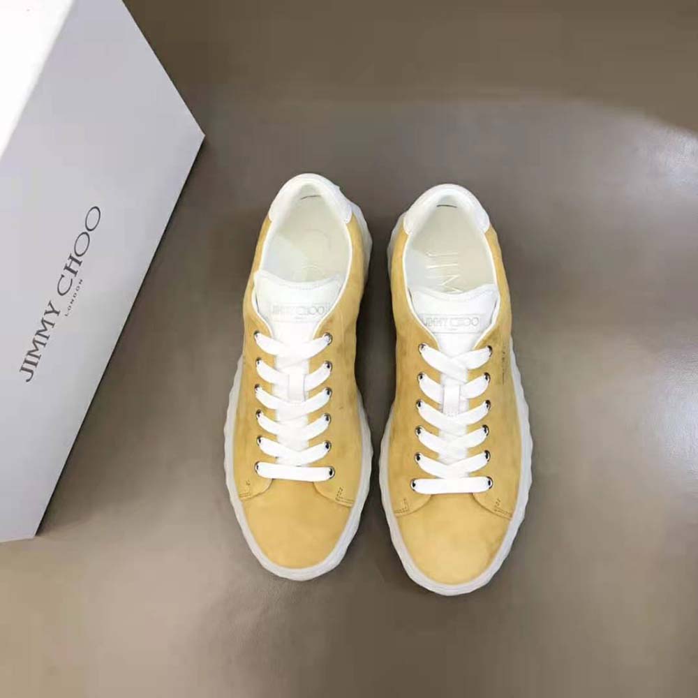 Close-up on crystal embellishments on Jimmy Choo Light Mocha Nappa trainers