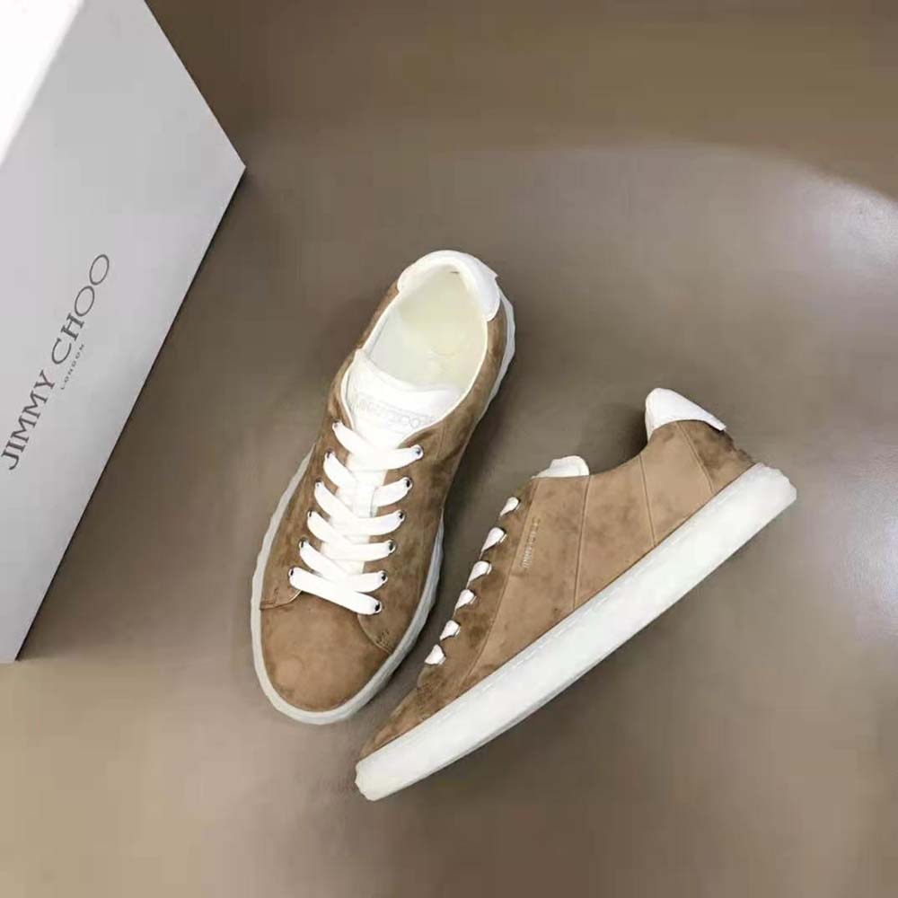Top-down angle showing lace-up closure on Jimmy Choo brown low-top trainers