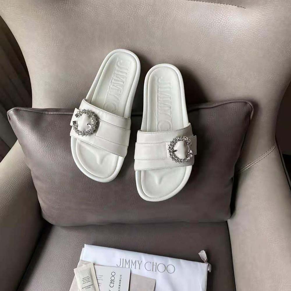 Close-up of crystal buckle detail on Jimmy Choo Fallon White Slides