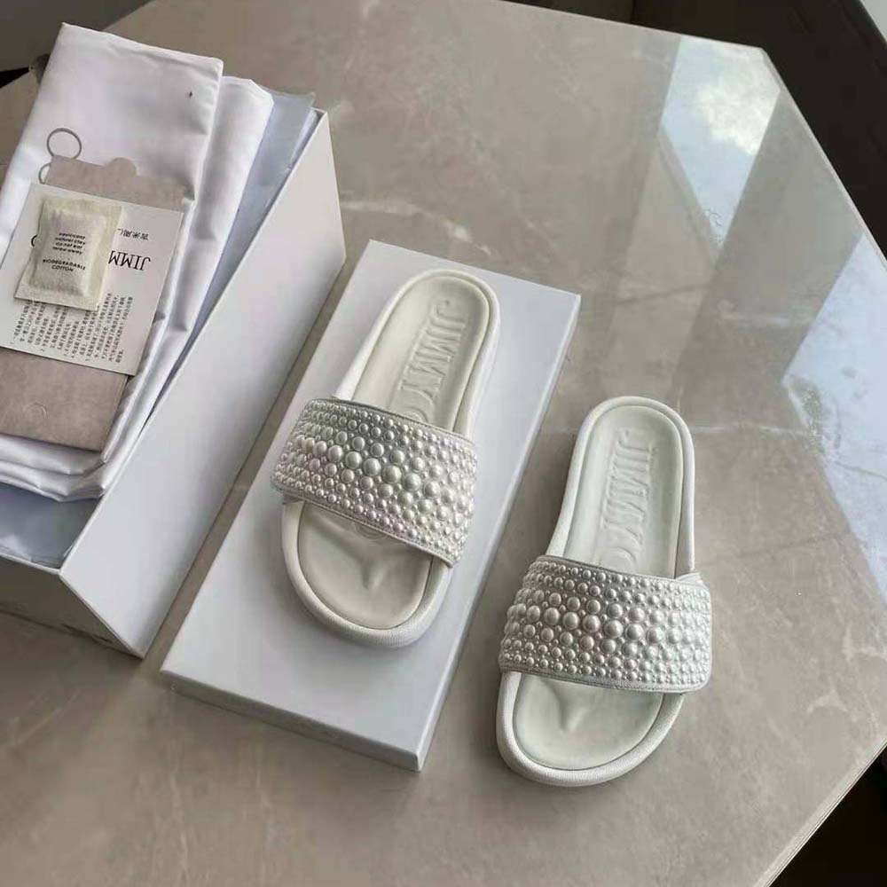 Overhead shot showing white canvas and leather texture of Jimmy Choo Women Fitz/F Pool Slides