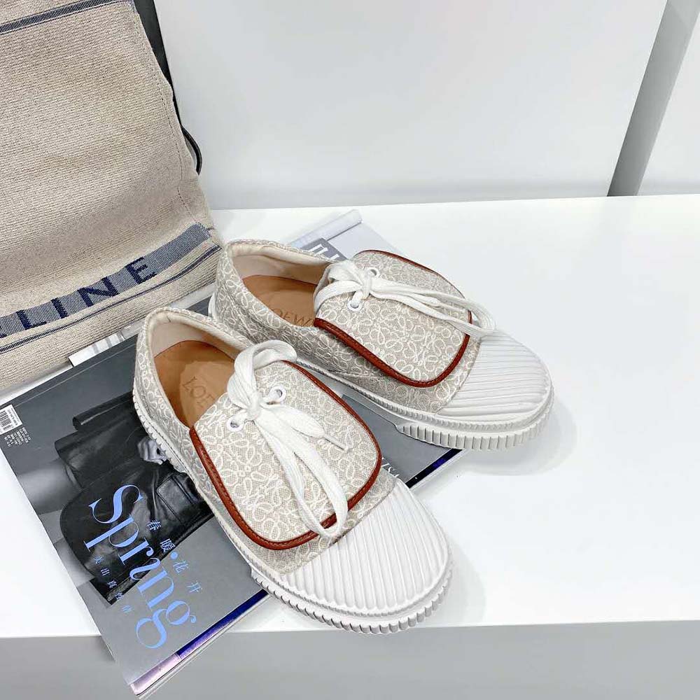 Overhead shot showing white canvas and lace-up closure on Loewe sneaker