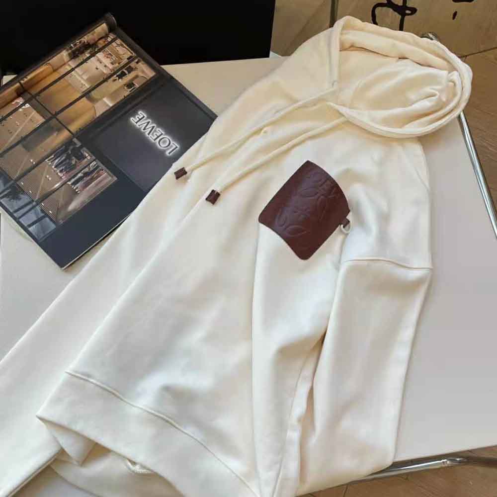 Side angle showing relaxed fit of Loewe Women Anagram Patch Hoodie