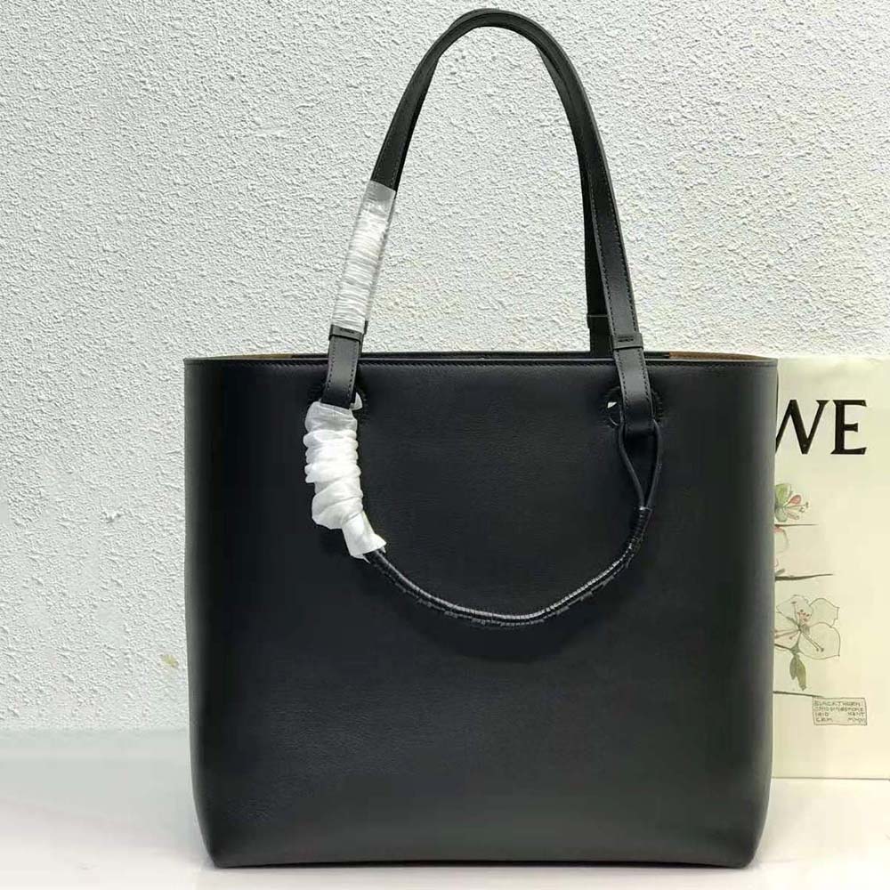 Side angle showing sleek silhouette of Loewe Women Anagram Tote
