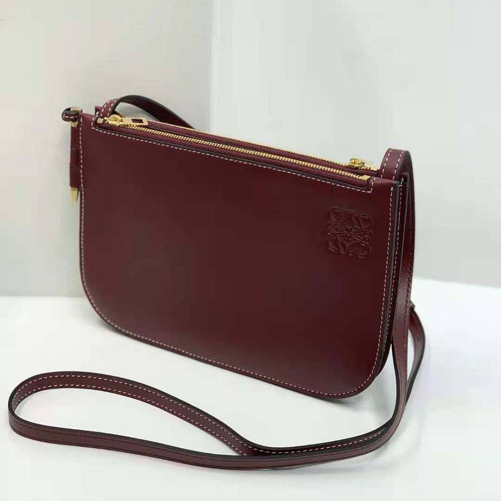 Side angle showing soft calfskin texture and slim profile of Loewe pouch