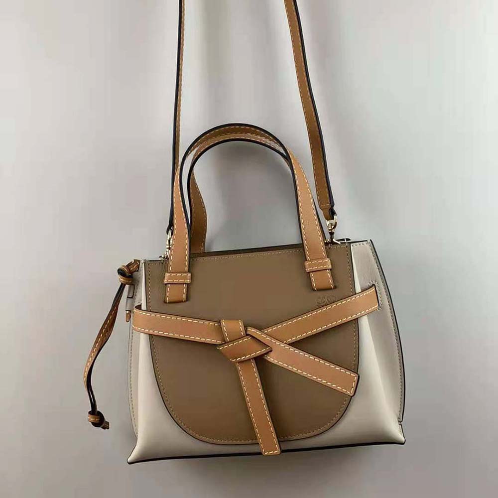 Side angle showing silhouette and flap closure of Loewe Women Mini Gate Top Handle Bag