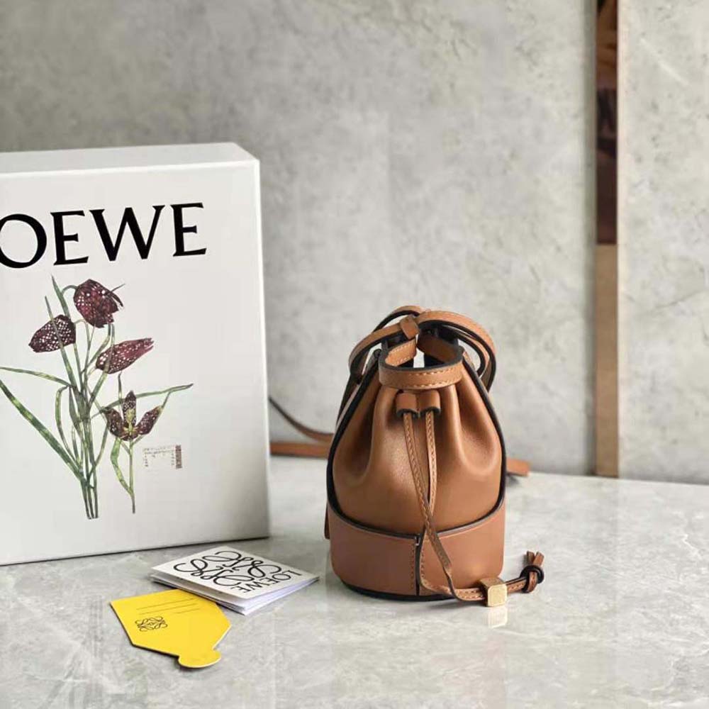 Close-up of rich brown leather and magnetic closure on Loewe Nano Balloon Bag
