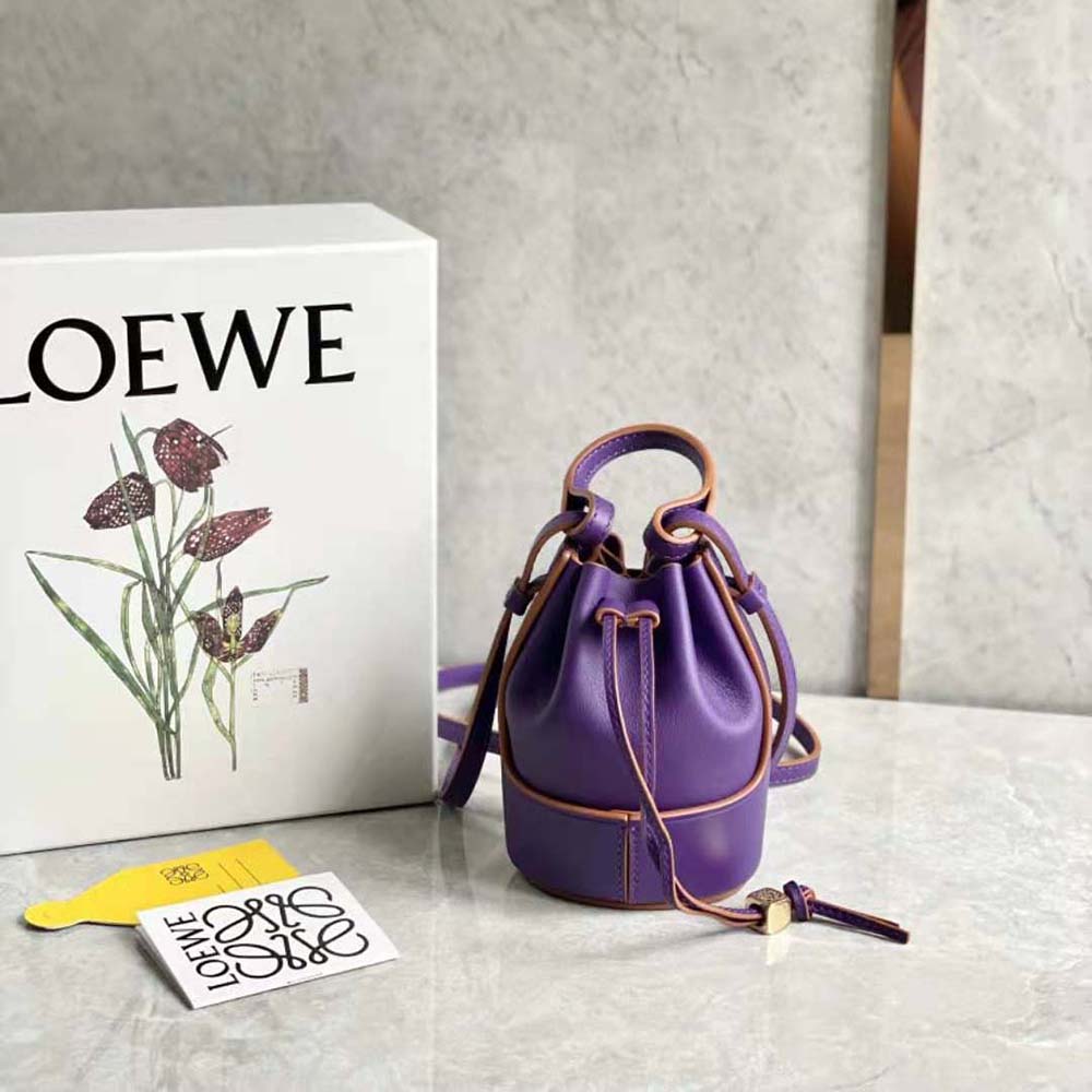 Close-up of purple calfskin and silver Loewe logo on Nano Balloon Bag