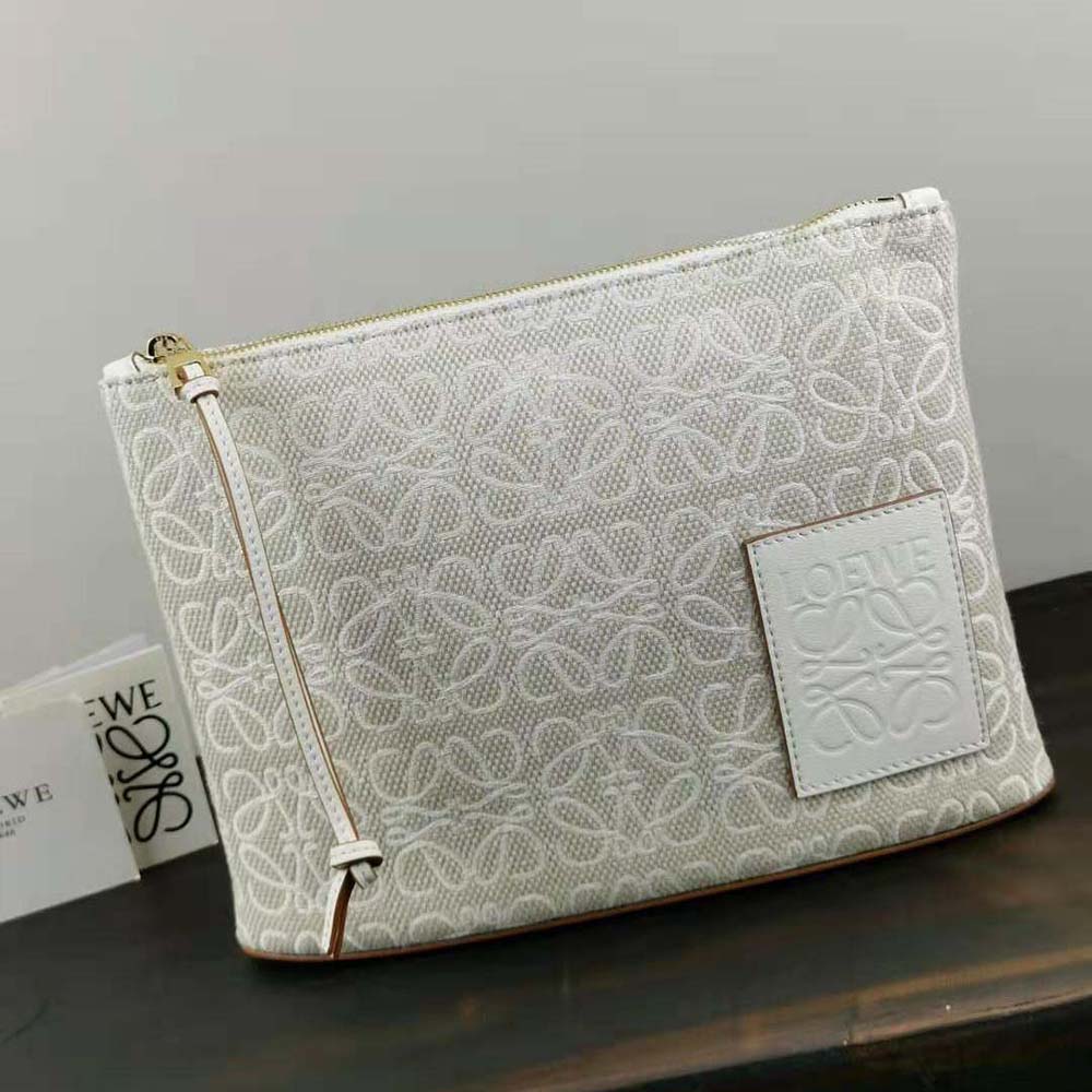 Close-up of Loewe Anagram silver-tone hardware on white pouch