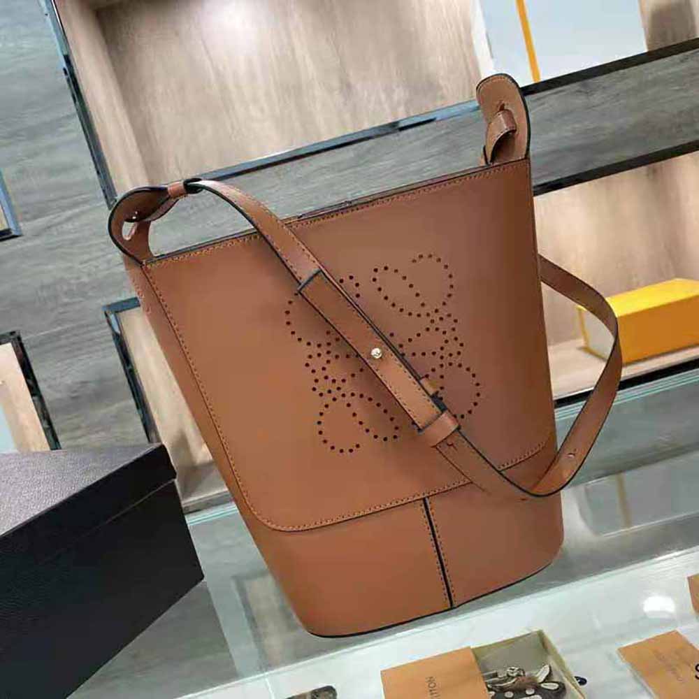 Close-up on embossed Anagram detail and gold hardware of Loewe Small Hobo Bag