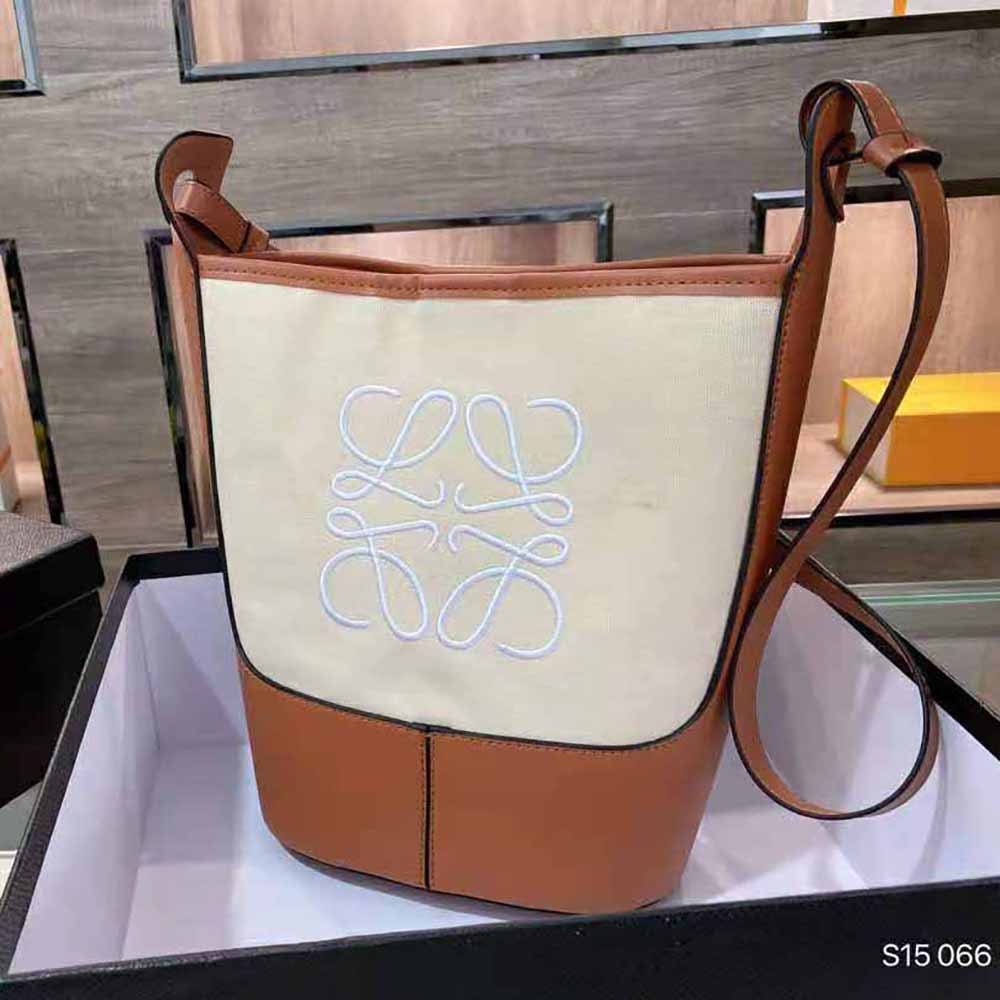 Close-up of gold Anagram detail and calfskin on Loewe Small Hobo Bag