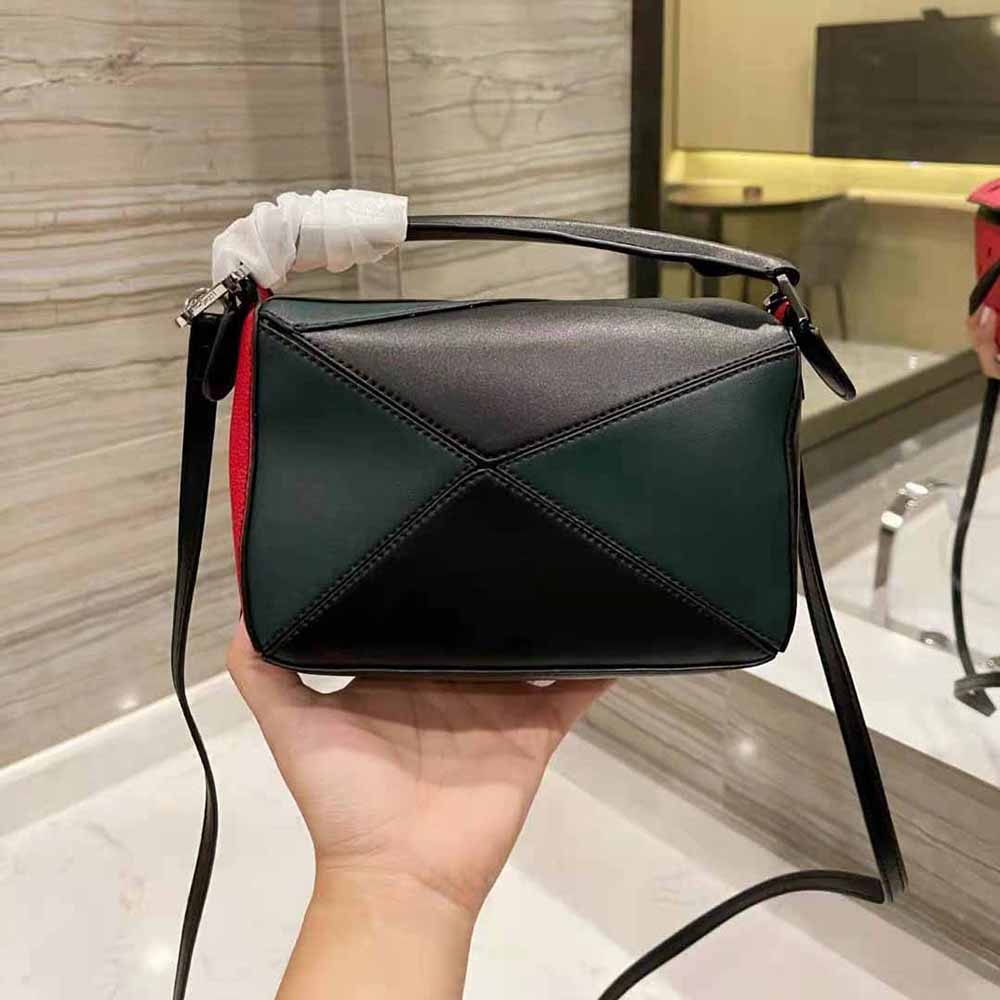 Side angle highlighting structured silhouette of Loewe Women Watermelon Mini Puzzle Bag