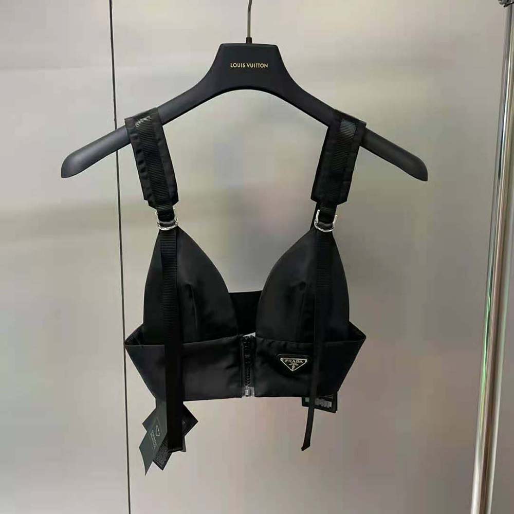 Close-up of Prada logo plaque on black Gabardine Top