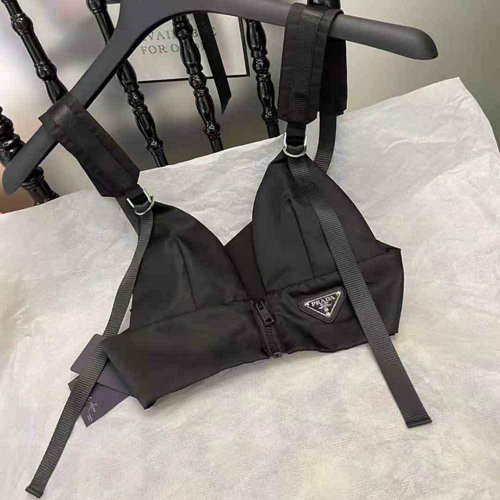 Side angle showcasing fit and fabric texture of Prada Women Re-Nylon Top