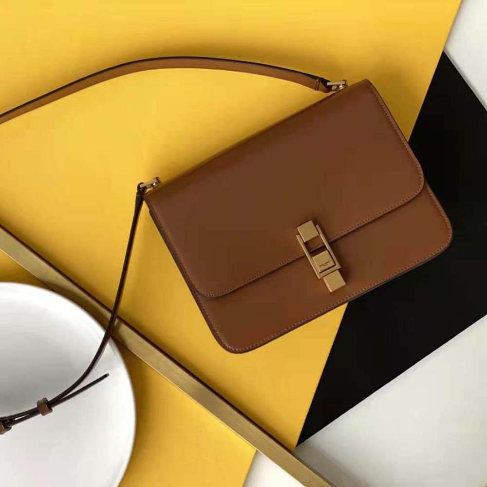 Close-up of gold YSL logo hardware on Saint Laurent Le Carre Satchel flap
