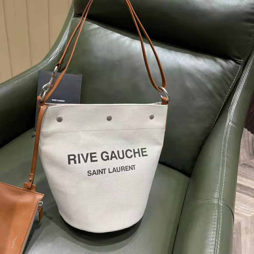 Close-up of gold YSL logo on Linen-Brown bucket bag