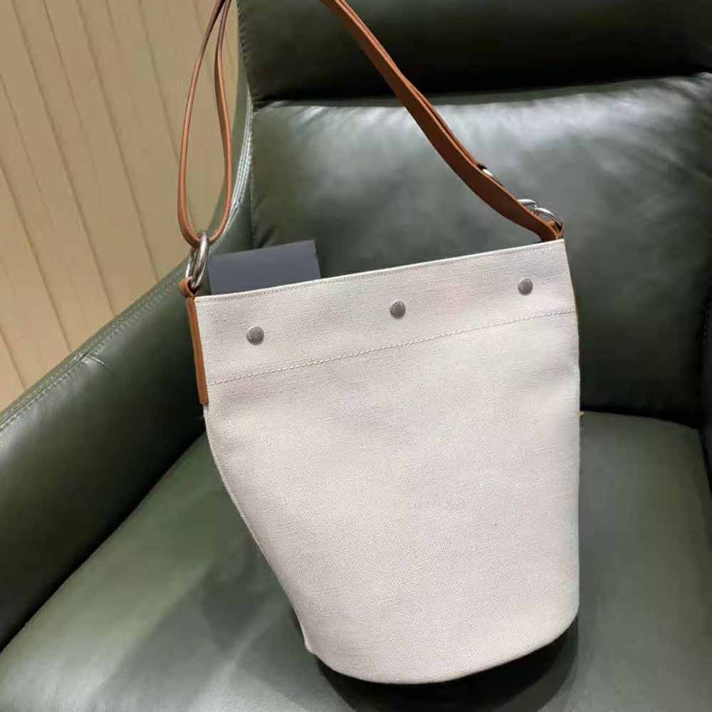 Side angle showing drawstring closure of Saint Laurent YSL bucket bag