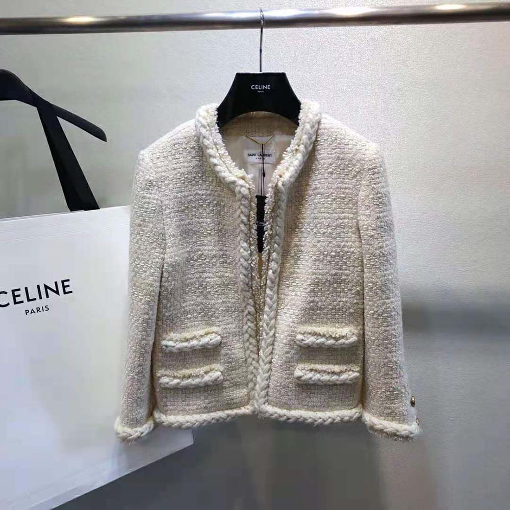 Side profile showing tailored silhouette of Saint Laurent YSL short jacket