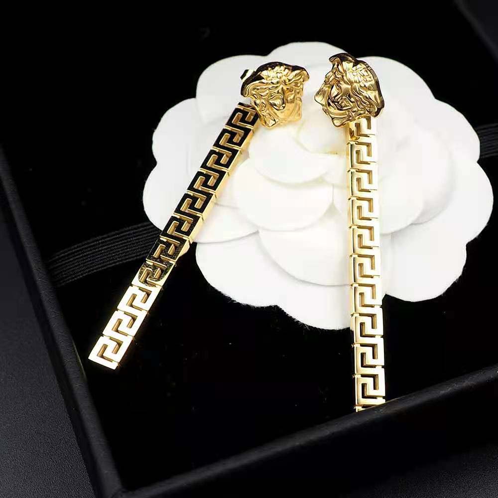 Side profile of Versace Women Greca Drop Earrings-Gold showing drop silhouette