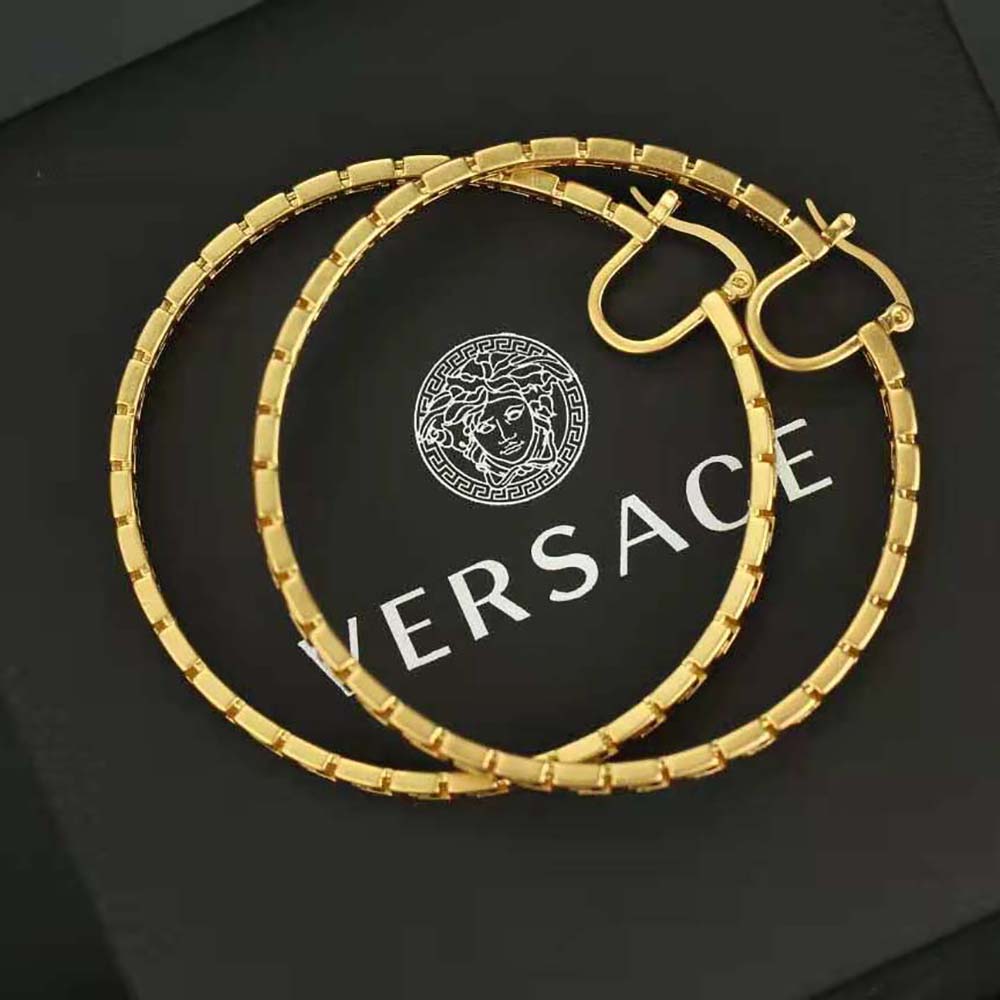 Side profile of Versace Women Greca Hoop Earrings-Gold with clasp visible