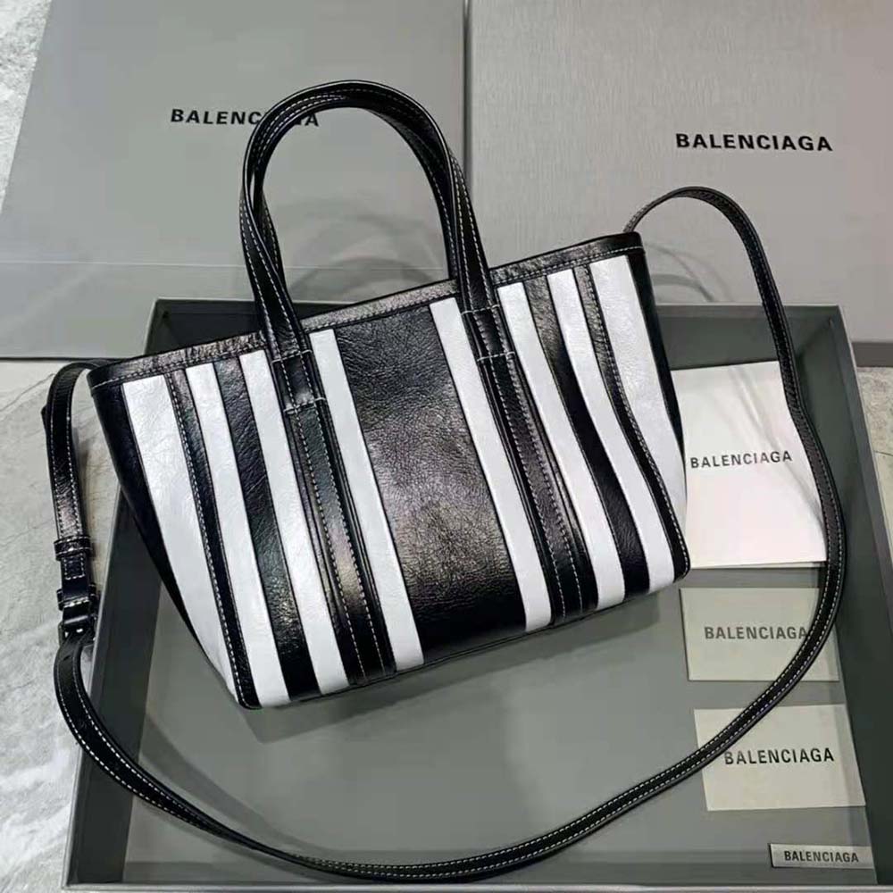 Side profile showcasing silhouette of Balenciaga Women Barbes Small East-West Shopper Bag in Black