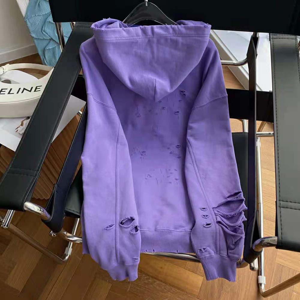 Side profile showing relaxed fit of Balenciaga Women Caps Destroyed Hoodie