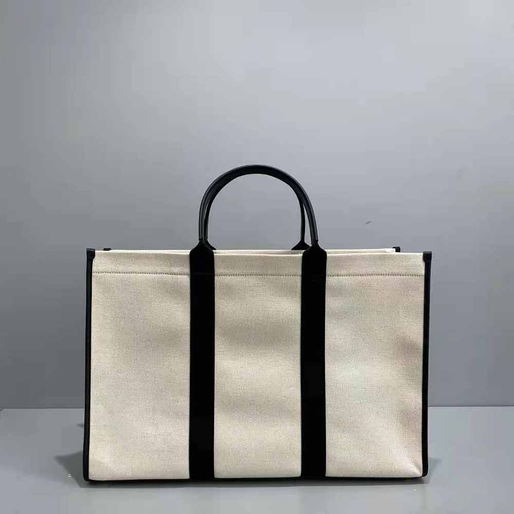 Side angle highlighting spacious silhouette of Balenciaga Women Hardware Large Tote Bag-White