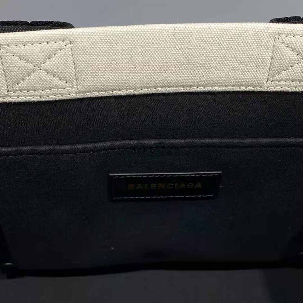 Side angle showing strap and silhouette of Balenciaga Small Tote Bag White