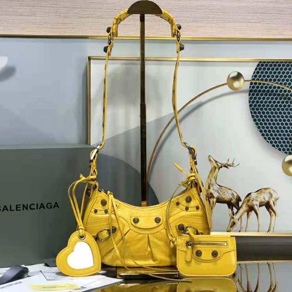 Close-up of gold-tone buckle on Balenciaga Women Le Cagole XS Shoulder Bag