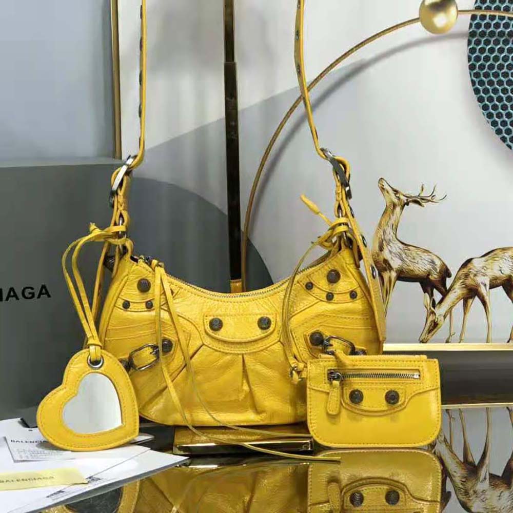 Side angle showing silhouette of Balenciaga Women Le Cagole XS Shoulder Bag