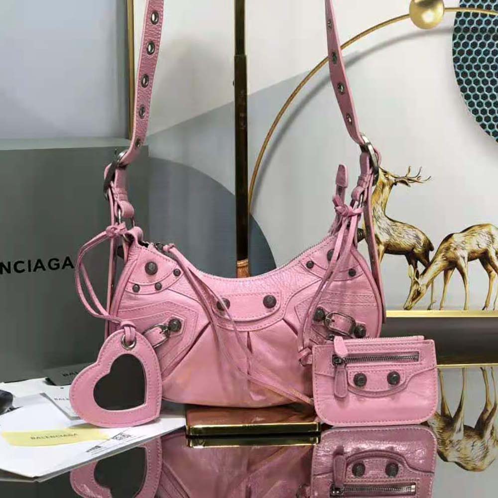 Side view showing compact silhouette of Balenciaga Women Le Cagole Shoulder Bag