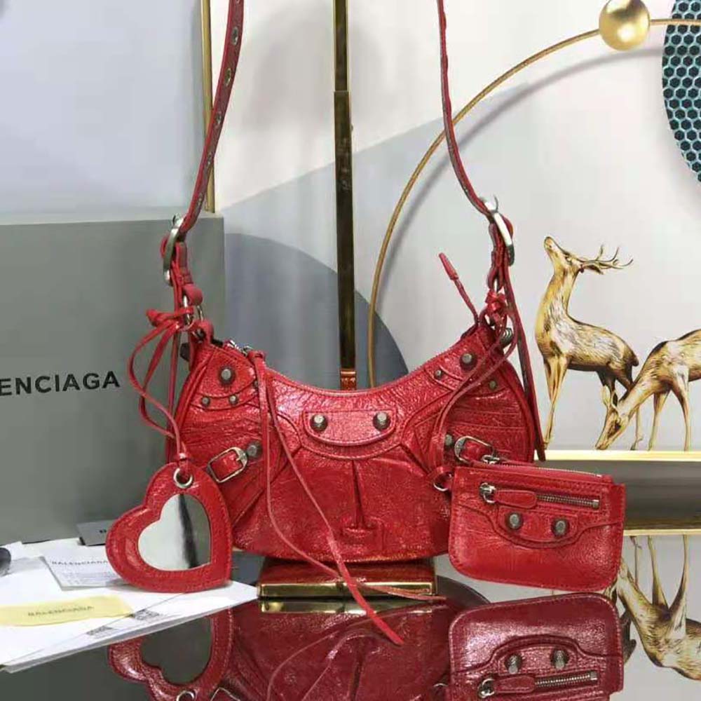Side profile showing compact silhouette of Balenciaga Women Le Cagole XS Shoulder Bag