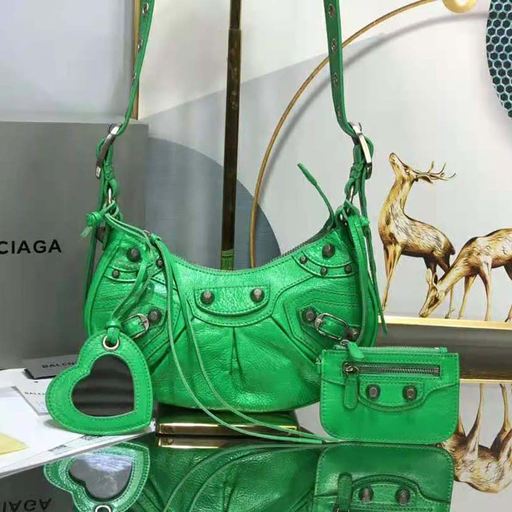 Side angle showing compact size and adjustable strap of Balenciaga shoulder bag