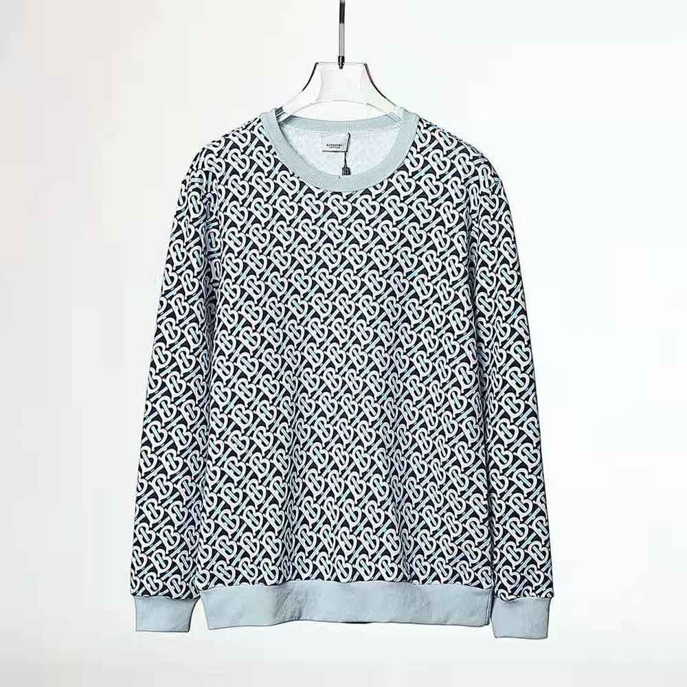 Close-up detail of Burberry monogram print on blue cotton sweatshirt